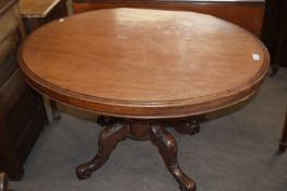 Victorian mahogany veneered oval top loo table raised on a turned column and four outswept legs, 110