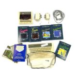 A vintage Acorn computer and accessories to include: - Acorn Electron keyboard - Acorn casette