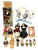 A mixed lot of various small dolls and figures in various costumes, to also include: - A boxed Happy