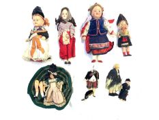 A mixed lot of dolls in traditional dress from around the world, to include: - A Danish girl with