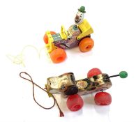 A pair of vintage 1960s wooden and plastic Fisher Price pull-along toys to include: - Little