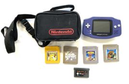 A Gameboy Advance in a Nintendo branded case, with game cartridges to include: - Pokemon Yellow -