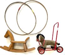 A mixed lot of vintage toys to include: - 2 wooden Victorian hoops - Small wooden rocking horse -