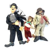 A mixed lot of vintage marionette puppets and a doll to include: - Charlie Chaplin puppet - Clown