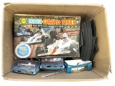 A box containing a boxed Scalextric Grand Prix 8 set (unchecked for completeness), extra track and 3