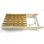 A sturdy handcrafted and painted wooden child's toboggan. Approximately 107 x 50cm