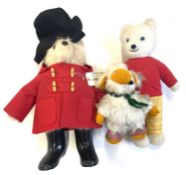 A mixed lot of vintage soft toys formed as classic characters to include: - Paddington Bear - Rupert