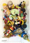 A large quantity of vintage Disney figurines and models, featuring Snow White and the Seven Dwarves,