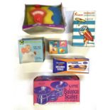 A mixed lot of vintage toys in original boxes to include: - A Katie Series set of shop scales - A