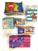 A mixed lot of vintage toys in original boxes to include: - A Katie Series set of shop scales - A