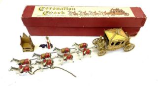 A boxed vintage die-cast Queen Elizabeth II Coronation Coach, with extra model of the Queen and a