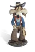 Warner Bros Model Wile- E -Coyote a ceramic or resin figure wearing a cowboy costume the top of base