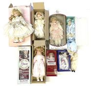 A quantity of boxed modern porcelain faced dolls and clowns, to include: - The Classique Collection: