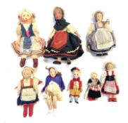A mixed lot of vintage dolls in traditional dress from around the world, to include: - A Belgian