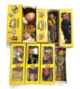 A group of 1960s - 1970s Pelham puppets in original boxes to include: - Policeman - Witch lady -