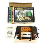 A boxed Binatone MK10 Colour TV Game by Magnavox, with instructions.