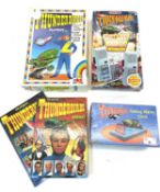 Mixed lot of Thunderbirds collectibles, to include: - A Grandstar Walkie Talkie set - A Dekker