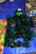 A QUANTITY OF GREEN GLASS RUMMERS AND MATCHING SMALL SPIRIT GLASSES