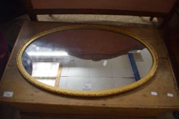OVAL WALL MIRROR IN GILT EFFECT FRAME
