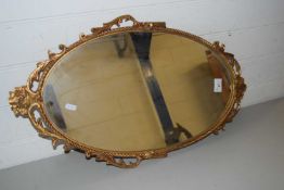 20TH CENTURY OVAL WALL MIRROR IN ORNATE METAL FRAME