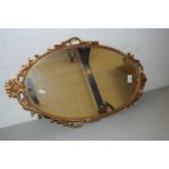 20TH CENTURY OVAL WALL MIRROR IN ORNATE METAL FRAME