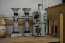 PAIR OF CERAMIC CANDLESTICKS TOGETHER WITH A NOVELTY SPIRIT BOTTLE (3)