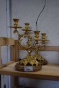 PAIR OF REPRODUCTION GILT METAL TWO BRANCH CANDELABRA ON POLISH STONE BASES