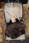 SUITCASE CONTAINING FUR WRAP AND OTHER ITEMS