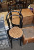 PAIR OF BLACK PAINTED AND CANE SEATED BENTWOOD CAFE CHAIRS