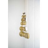 SIX VARIOUS BRASS BELL WEIGHTS