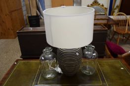 CONTEMPORARY TABLE LAMP AND TWO GLASS DEMIJOHNS