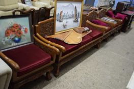 FAR EASTERN HARDWOOD LOUNGE SUITE COMPRISING A THREE SEATER SOFA AND FOUR ARMCHAIRS ALL DECORATED