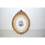 VICTORIAN HEAD AND SHOULDERS PORTRAIT OF A LADY ON MILK GLASS BACKING SET IN AN OVAL GILT FRAM