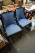 PAIR OF EBONISED FRAMED CHAIRS WITH BLUE UPHOLSTERY AND CARVED SWANS HEAD DETAIL