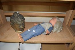 MIXED LOT: CONTEMPORARY CAST METAL BUDDHA'S HEAD TOGETHER WITH A VINTAGE DOLL (2)