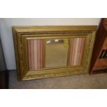 19TH CENTURY GILT PICTURE FRAME CONTAINING A MIRROR, 100 X 68 CM