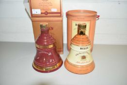 BELLS SCOTCH WHISKY, TWO COMMEMORATIVE WEIGHED BOTTLES, CHRISTMAS 1999 AND ONE OTHER