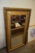 19TH CENTURY GILT PICTURE FRAME CONTAINING A MIRROR, 70 CM X 123 CM