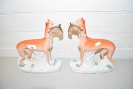 PAIR OF STAFFORDSHIRE MODELS OF GREYHOUNDS WITH RABBITS
