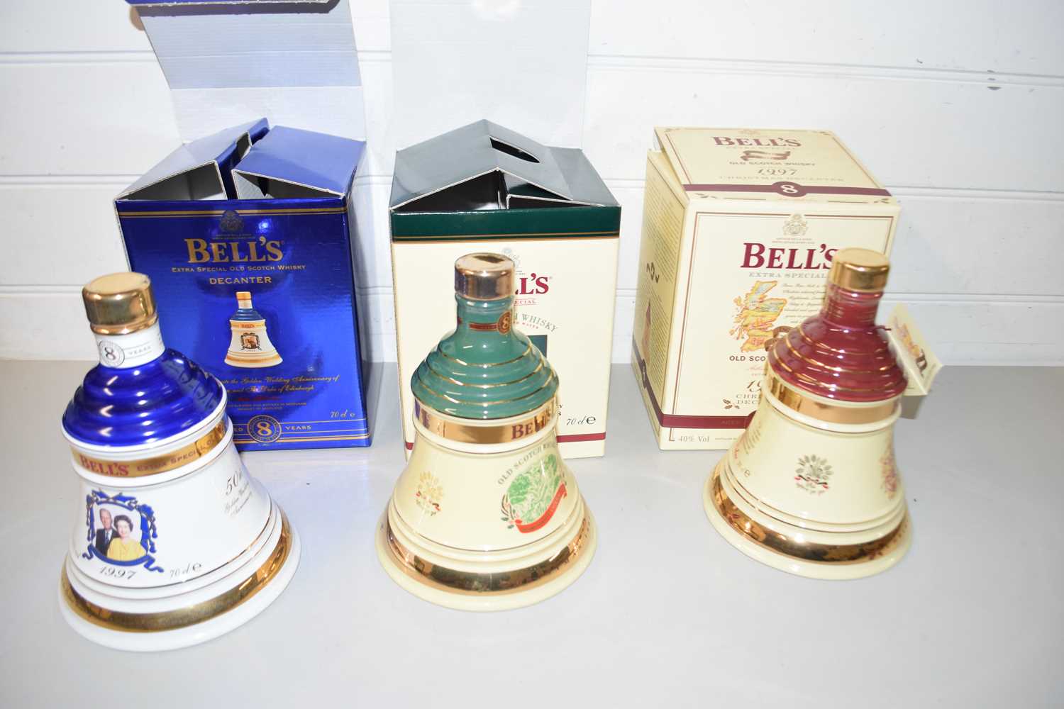 BELLS SCOTCH WHISKEY COMMEMORATIVE DECANTERS COMMEMORATING THE GOLDEN WEDDING ANNIVERSARY OF QUEEN