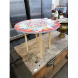 CIRCULAR COFFEE TABLE WITH STAR DECORATED TOP