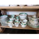 QUANTITY OF EDWARDIAN GILT AND GREEN DECORATED TEA WARES