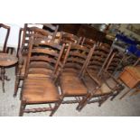 SET OF EIGHT OAK LADDER BACK DINING CHAIRS