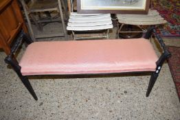 LATE VICTORIAN SMALL DUET STOOL OR WINDOW SEAT WITH EBONISED FRAME AND PINK UPHOLSTERY