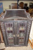 LATE VICTORIAN DARK OAK AND LEAD GLAZED TWO DOOR CORNER CABINET