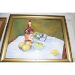 GABRIELLE LYON STILL LIFE STUDY OF APPLES, LEMONS AND A BOTTLE OF SPIRITS ON A TABLE, OIL ON
