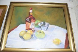 GABRIELLE LYON STILL LIFE STUDY OF APPLES, LEMONS AND A BOTTLE OF SPIRITS ON A TABLE, OIL ON