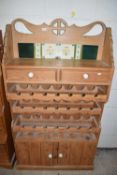 PINE TILE BACK SIDE CABINET WITH INTEGRAL WINE RACKS AND COVERED BASE