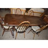 ERCOL DARK ELM REFECTORY TYPE DINING TABLE AND SIX STICK BACK CHAIRS