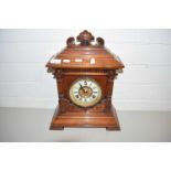 LATE 19TH/EARLY 20TH CENTURY MANTEL CLOCK IN ARCHITECTURAL HARDWOOD CASE